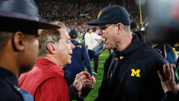 Michigan coach Jim Harbaugh shakes hands with Alabama coach Nick Saban after U-M's 27-20 overtime win over Alabama at Rose Bowl Stadium in Pasadena, California, on Monday, Jan. 1, 2024.